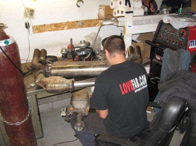 Final welded RM Racing muffler and stock cats.jpg