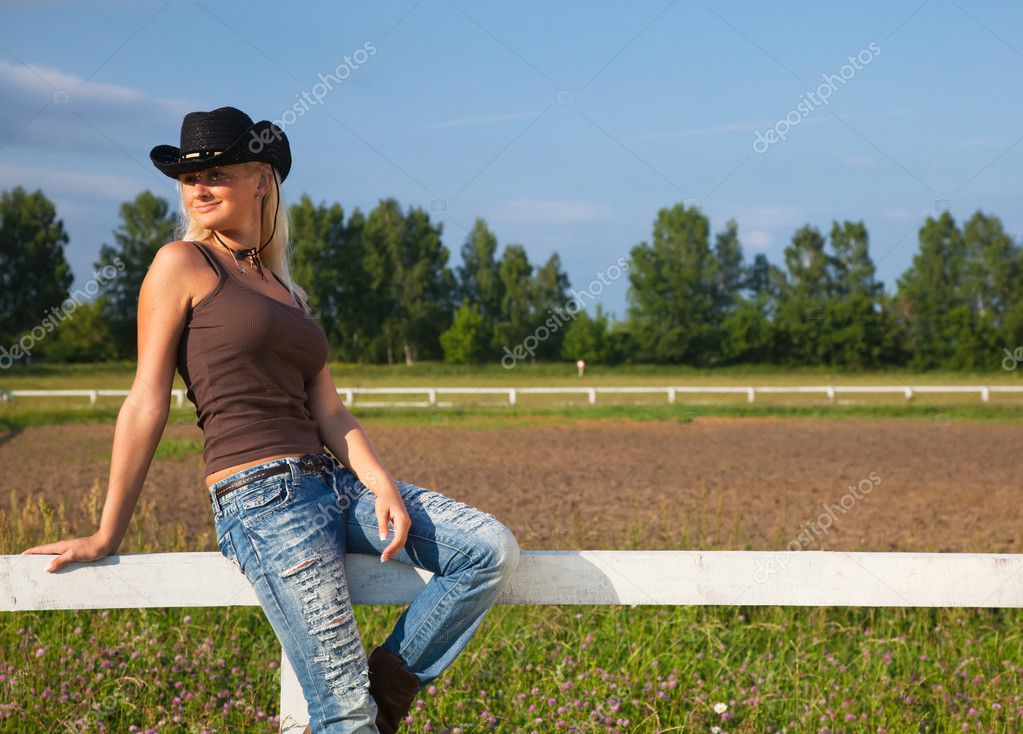 depositphotos_4022407-Young-cowgirl-sitting-on-a-fence.jpg